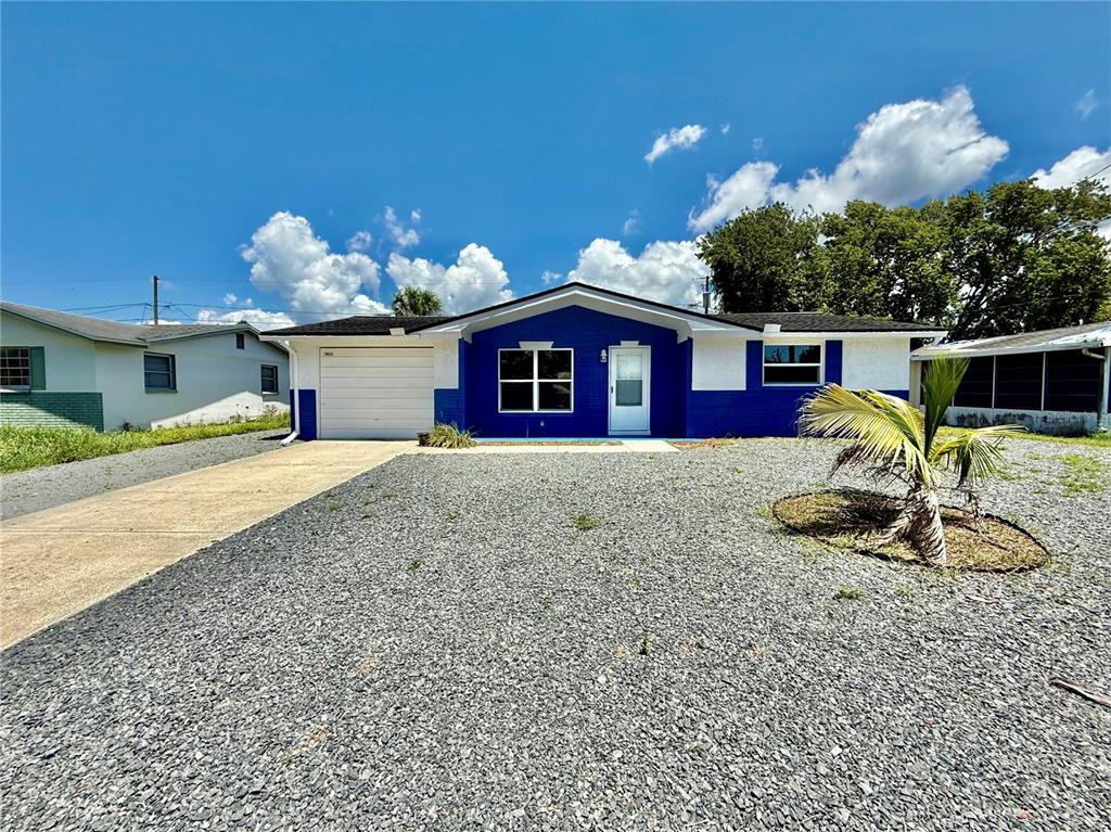 10824 Hillcrest Avenue Port Richey, FL 34668 - Photo 1 of 1 a front view of a house with garden