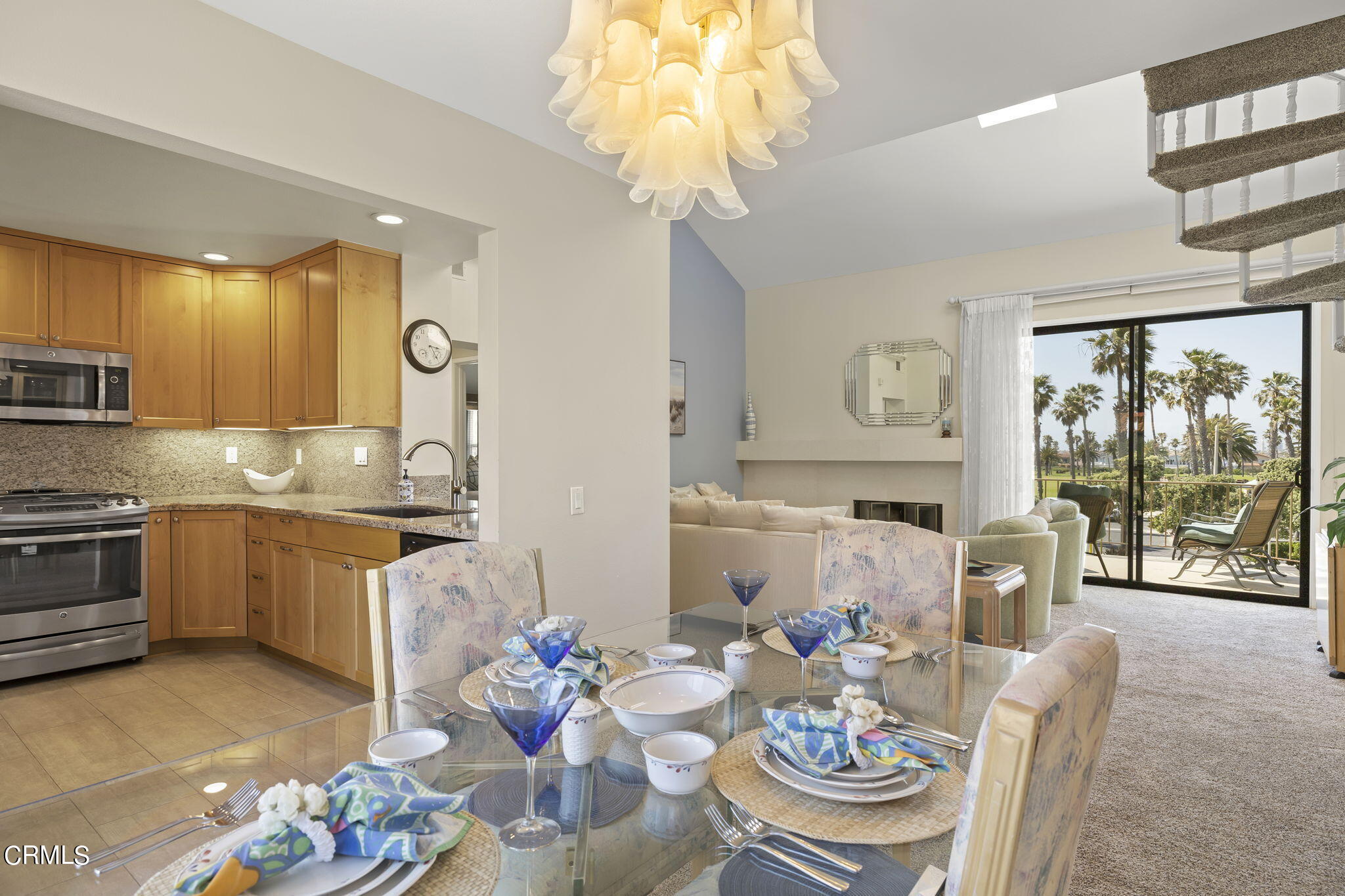 4700 San Sebastian Drive Oxnard, CA 93035 - Photo 23 of 74 a kitchen with granite countertop lots of white furniture a chandelier and a dining table