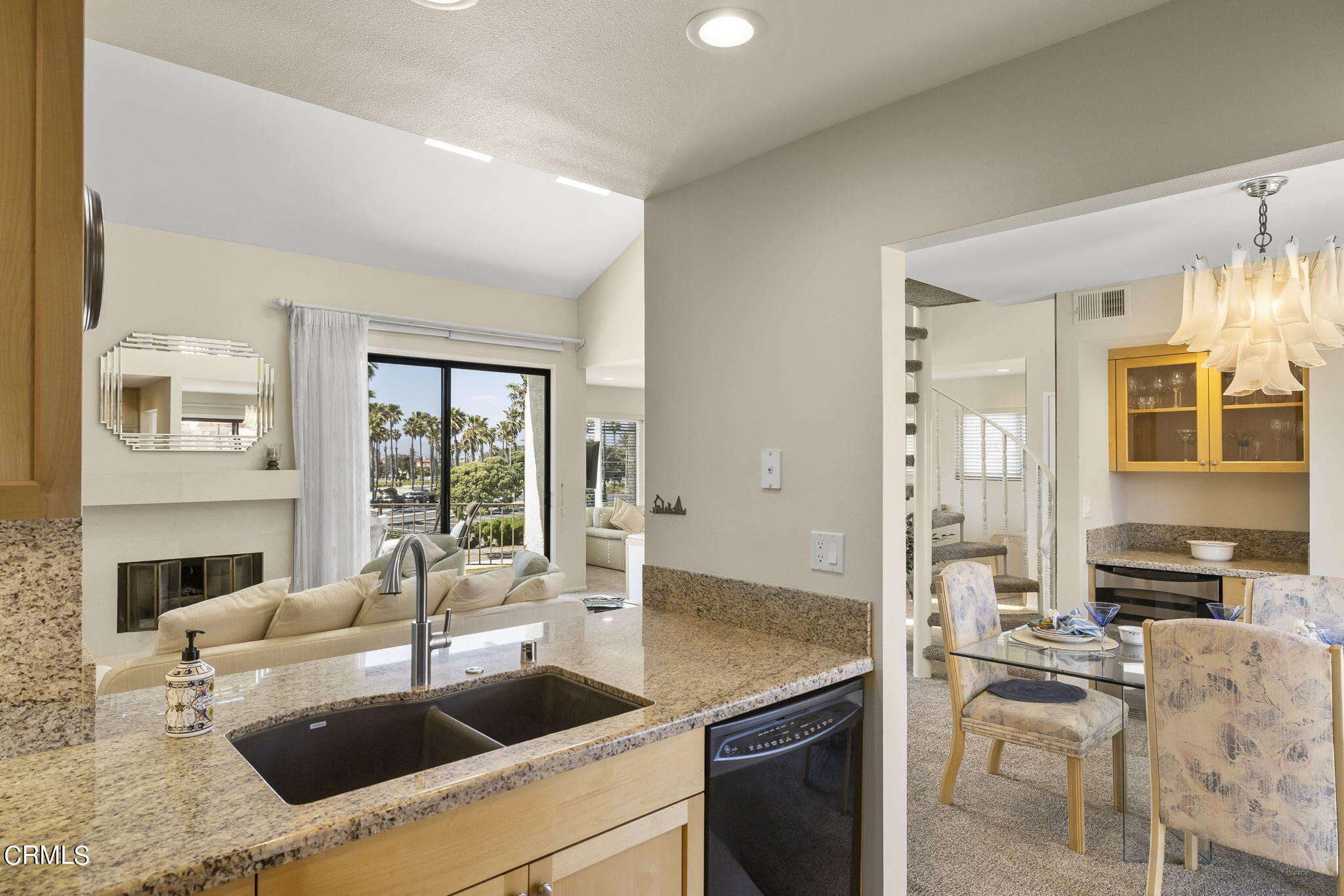 4700 San Sebastian Drive Oxnard, CA 93035 - Photo 26 of 74 a kitchen with granite countertop a sink and a stove top oven with wooden floor