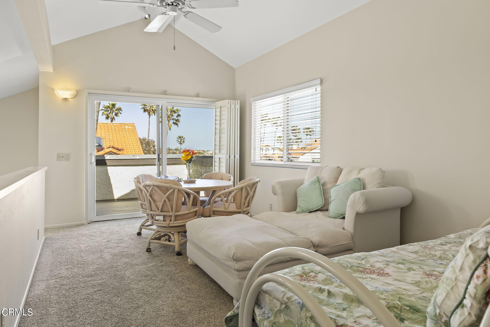 4700 San Sebastian Drive Oxnard, CA 93035 - Photo 47 of 74 a bedroom with a bed and a chandelier