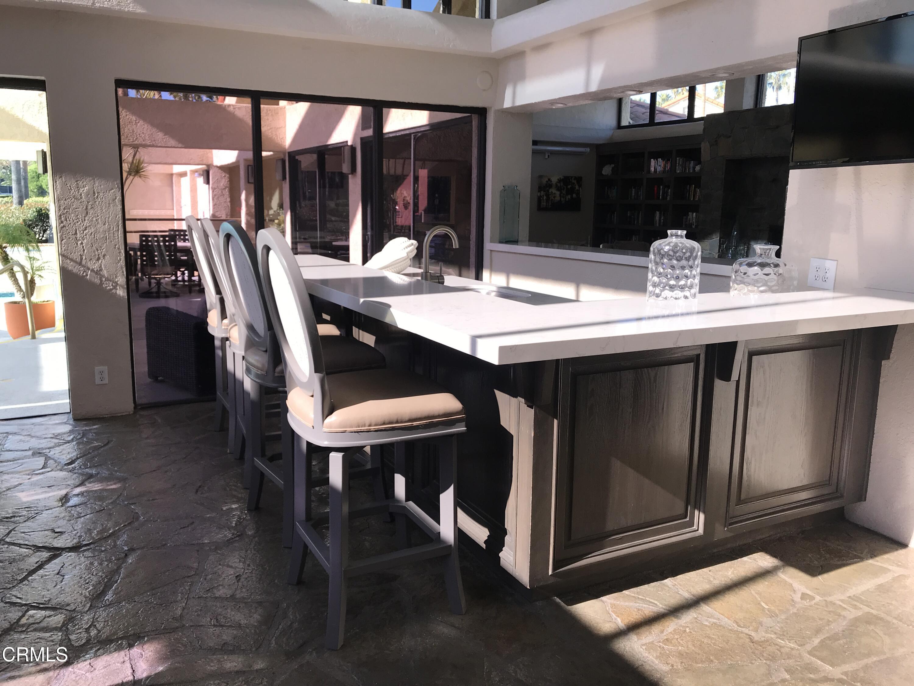 4700 San Sebastian Drive Oxnard, CA 93035 - Photo 61 of 74 a dining room with a table and chairs