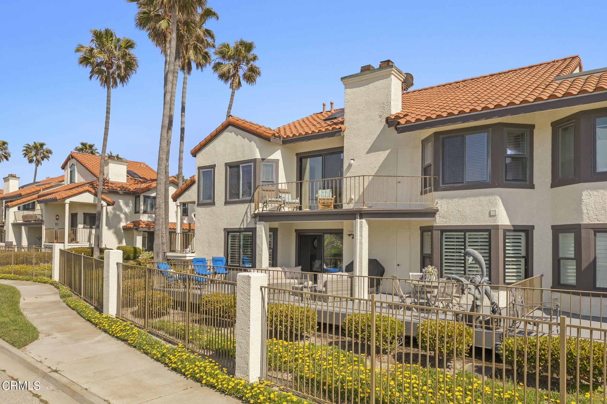 4700 San Sebastian Drive Oxnard, CA 93035 - Photo 9 of 74 a front view of a house with a yard
