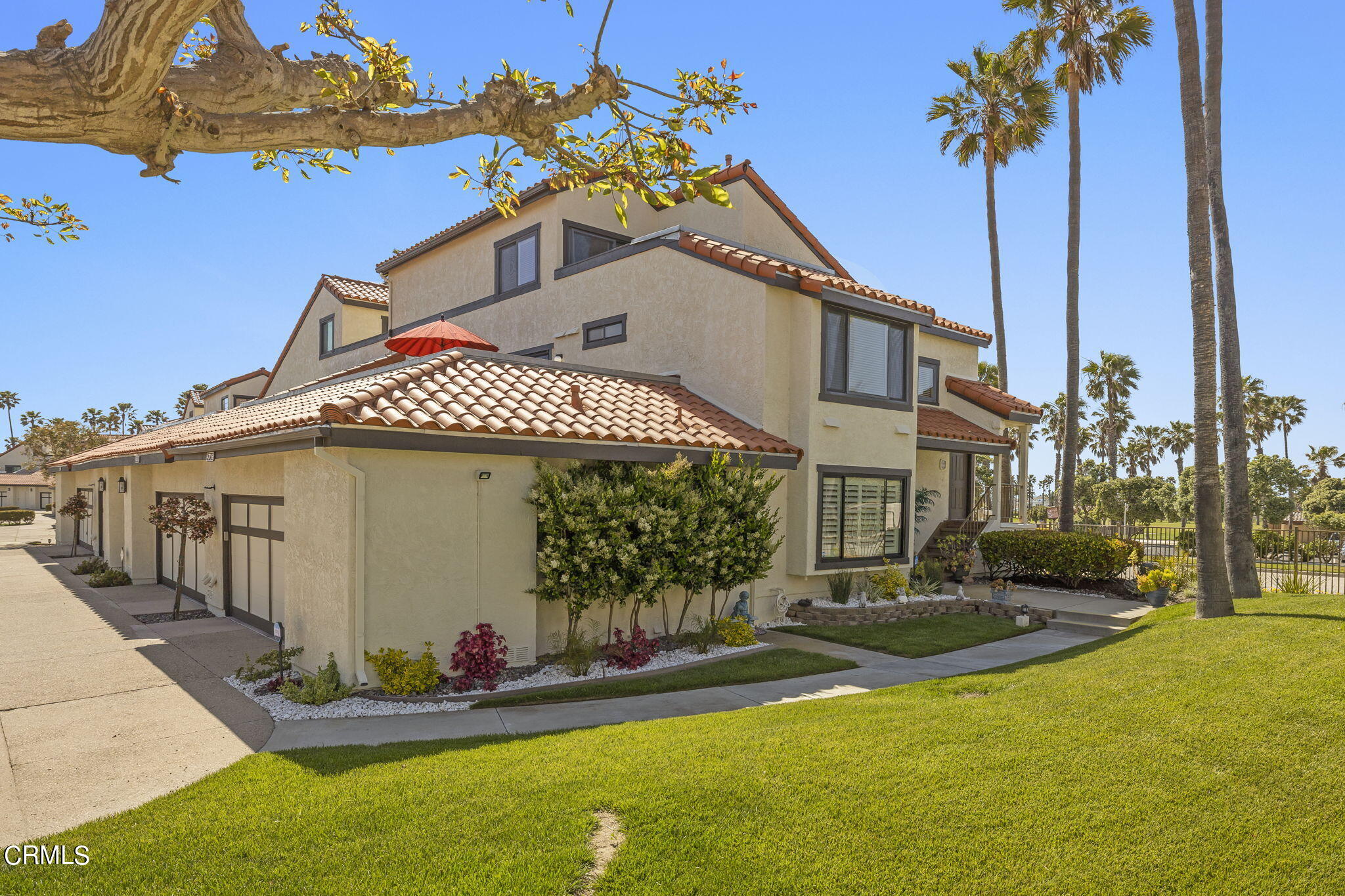 4700 San Sebastian Drive Oxnard, CA 93035 - Photo 10 of 74 a front view of a house with a yard