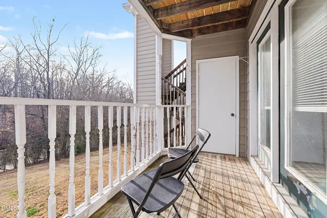 a view of a balcony with furniture