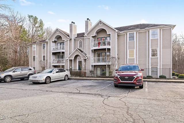 a view of street with parked cars