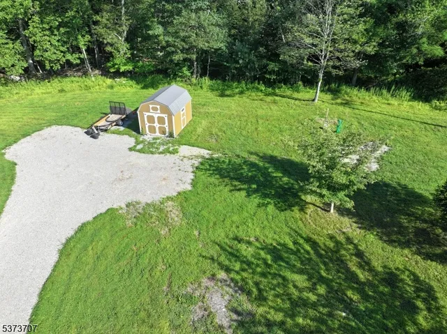 a garden view with a swimming pool