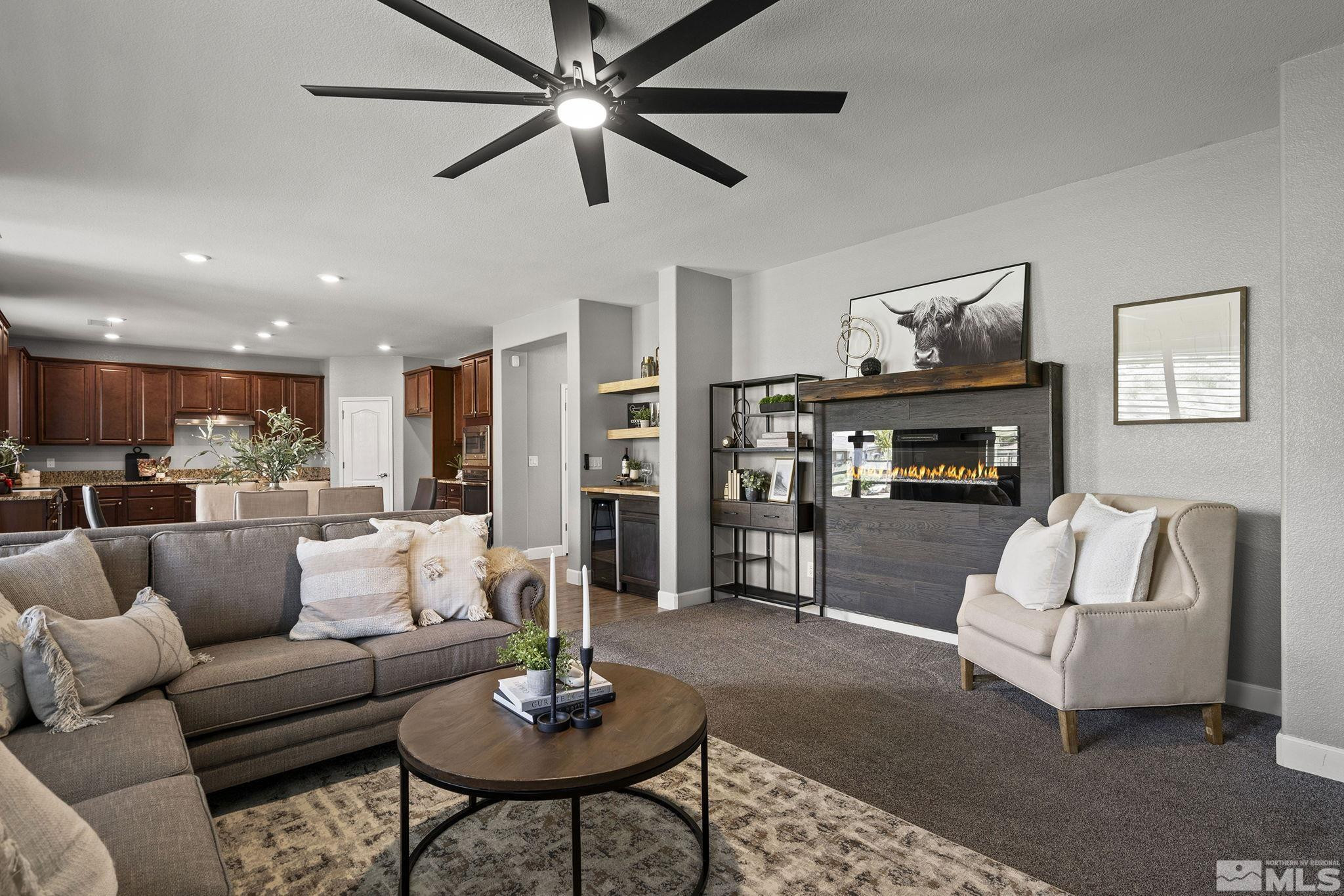 1820 Scott Valley Road Reno, NV 89523 - Photo 15 of 35 a living room with furniture kitchen view and a fireplace