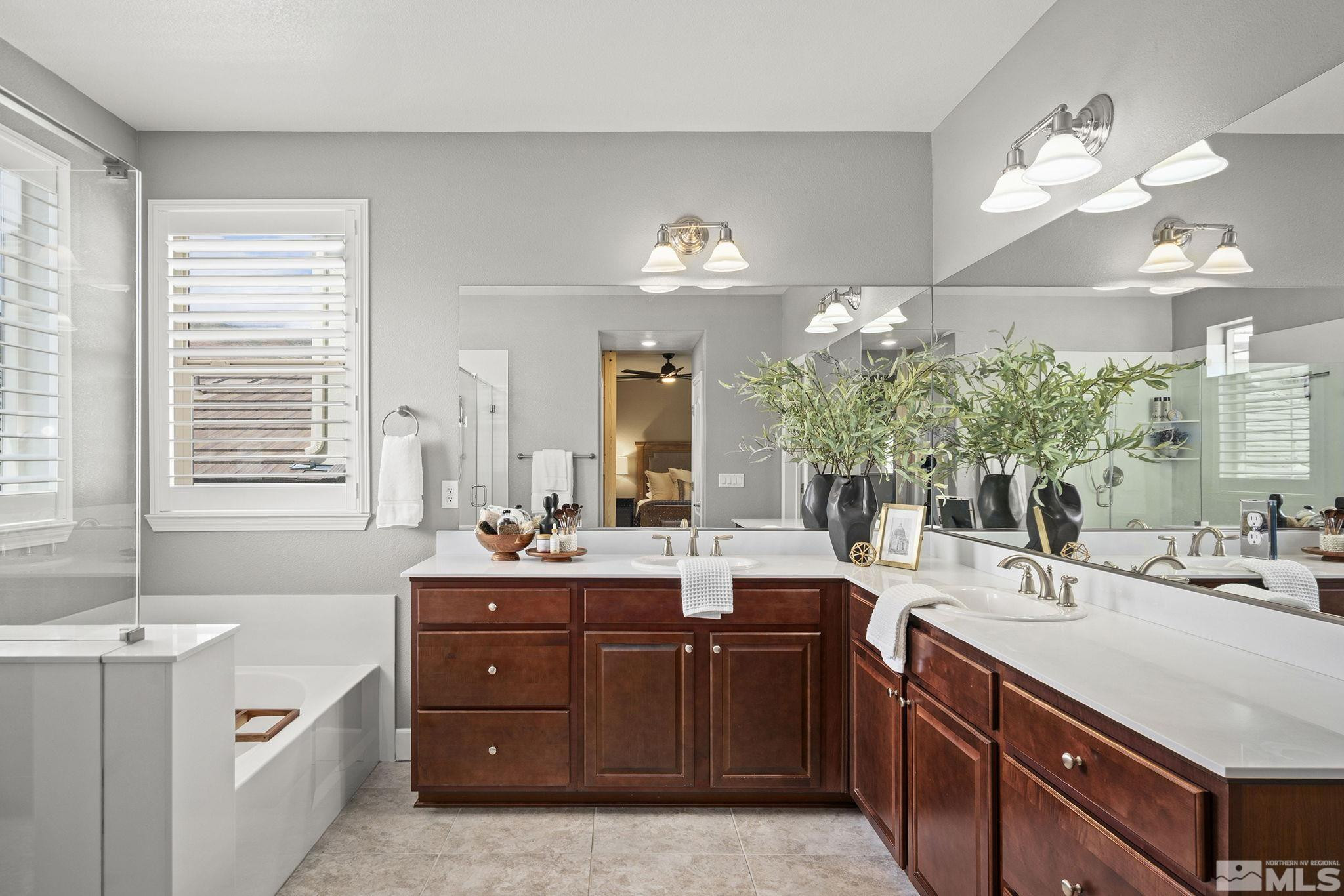 1820 Scott Valley Road Reno, NV 89523 - Photo 19 of 35 a bathroom with a sink double vanity and a mirror