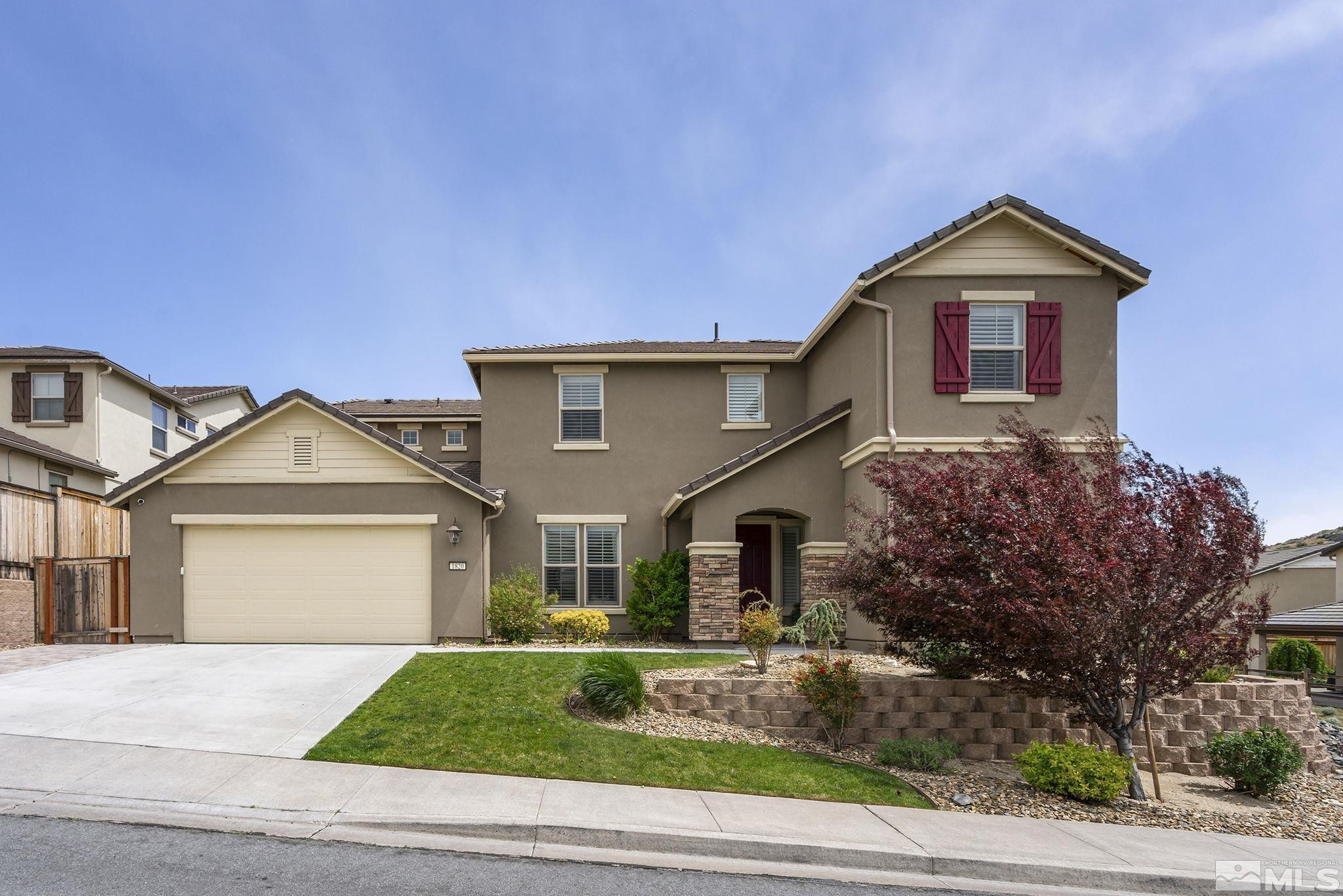 1820 Scott Valley Road Reno, NV 89523 - Photo 2 of 35 a front view of a house with a yard and garage
