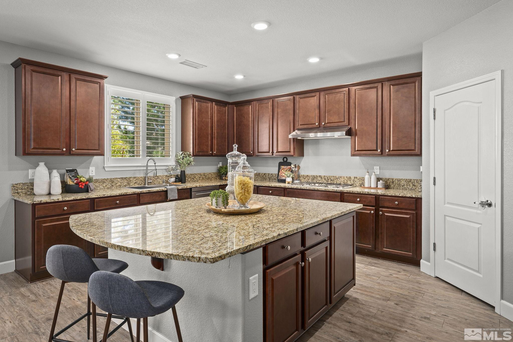 1820 Scott Valley Road Reno, NV 89523 - Photo 10 of 35 a kitchen with stainless steel appliances granite countertop a stove a sink and a refrigerator