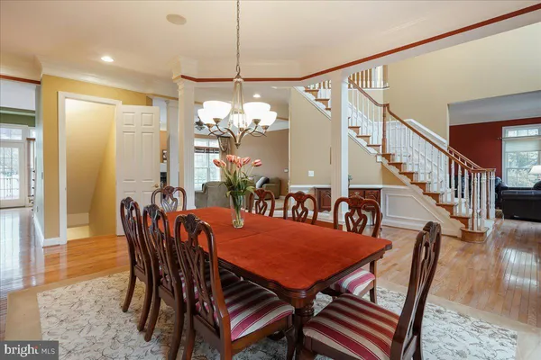 a living room with furniture a flat screen tv and a window