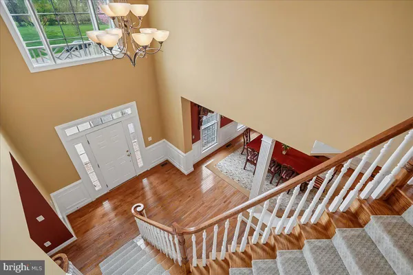 a large bathroom with a tub sink and a large mirror
