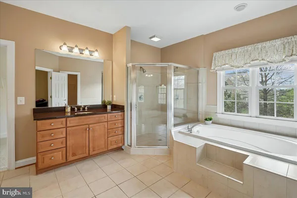 a view of a room with wooden floor and chair
