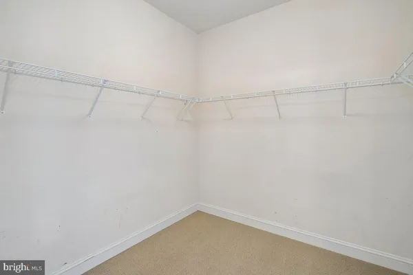 a bedroom with furniture and a flat screen tv