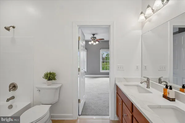 a view of a garden with a building in the background