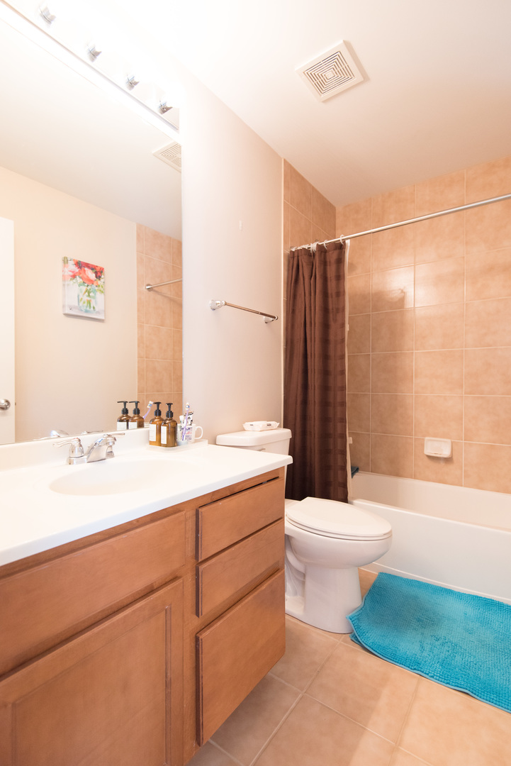 263 Aspen Pointe Road Vernon Hills, IL 60061 - Photo 14 of 16 a bathroom with a sink a toilet and shower