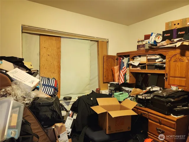 a bedroom with furniture and a window