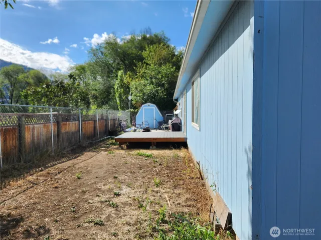 a view of a backyard with sitting area