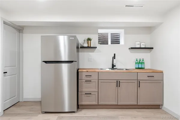 a kitchen with cabinets and stainless steel appliances