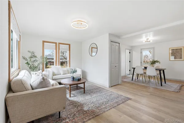 a living room with furniture and a table