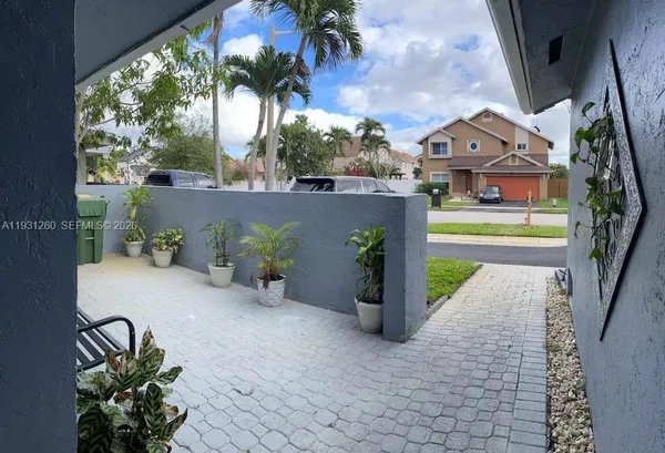 a house view with a backyard space