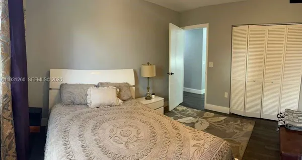 a bedroom with a bed and a couch