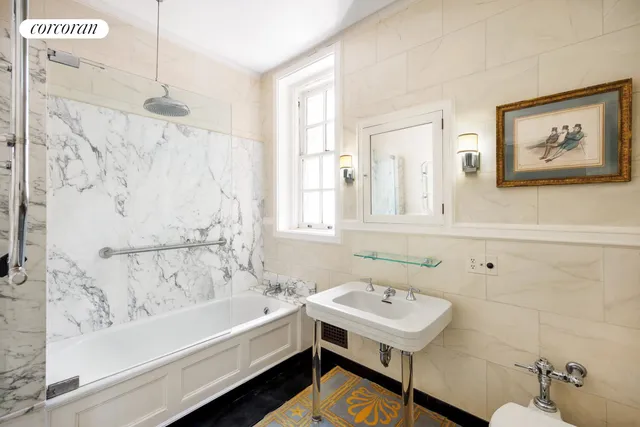 a bedroom with furniture and a fireplace