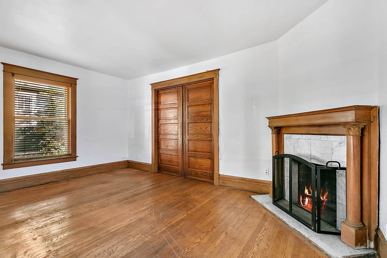 99 Pine Avenue Riverside, IL 60546 - Photo 4 of 31 a view of an empty room with window and a fireplace