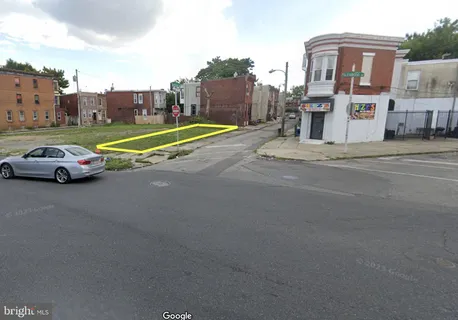 a view of a cars park in front of a building