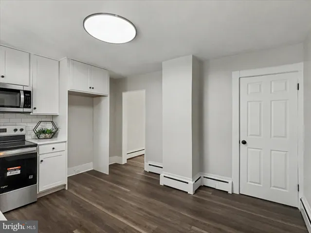 a bathroom with a sink a mirror and a shower