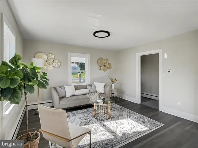 a view of a kitchen with wooden floor and a sink