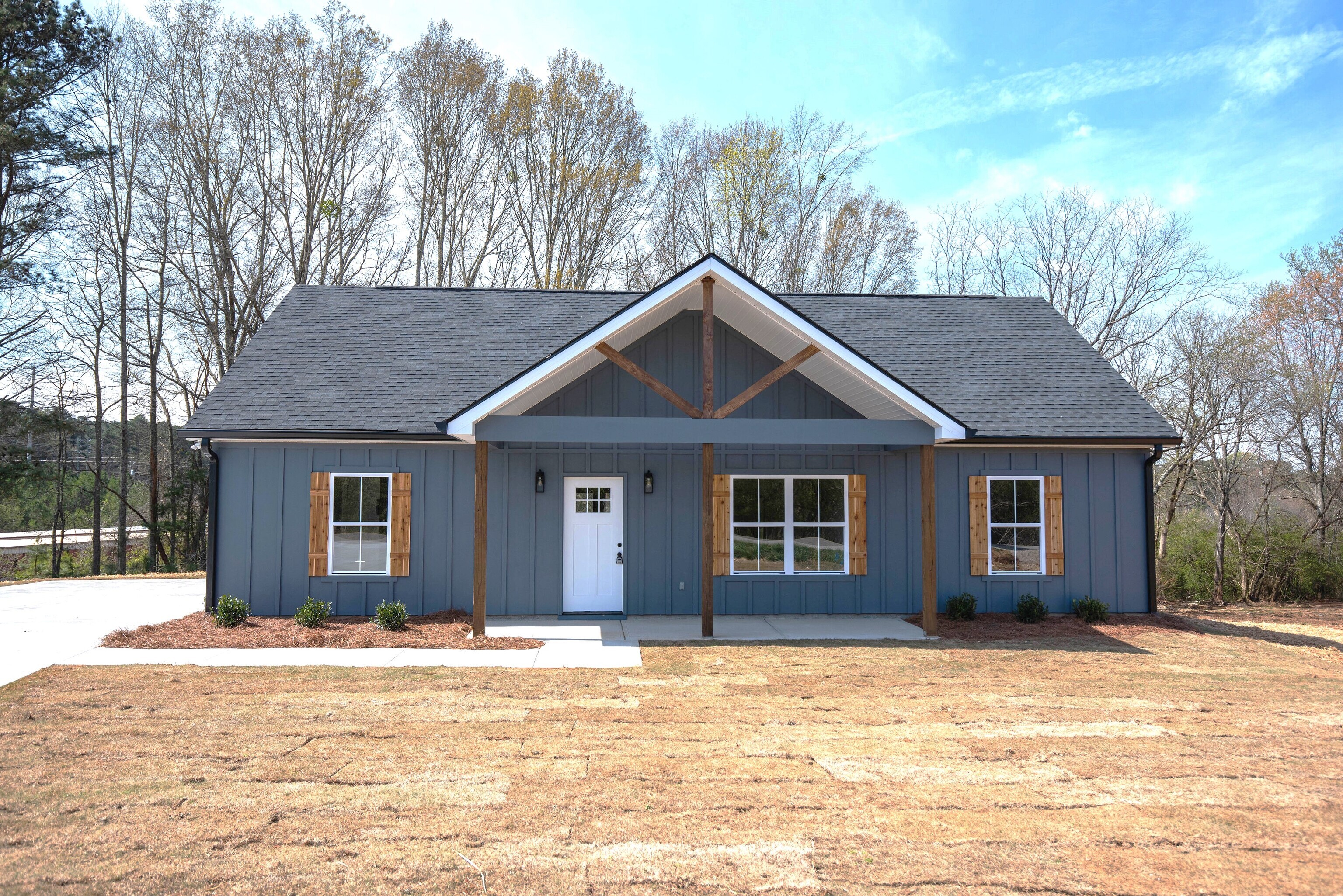 152 Addie Jane Lane, Unit 6 Buchanan, GA 30113 - Photo 1 of 28 a house that has a tree in front of it