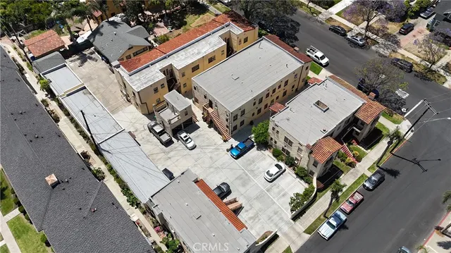 an aerial view of residential house with outdoor space and parking