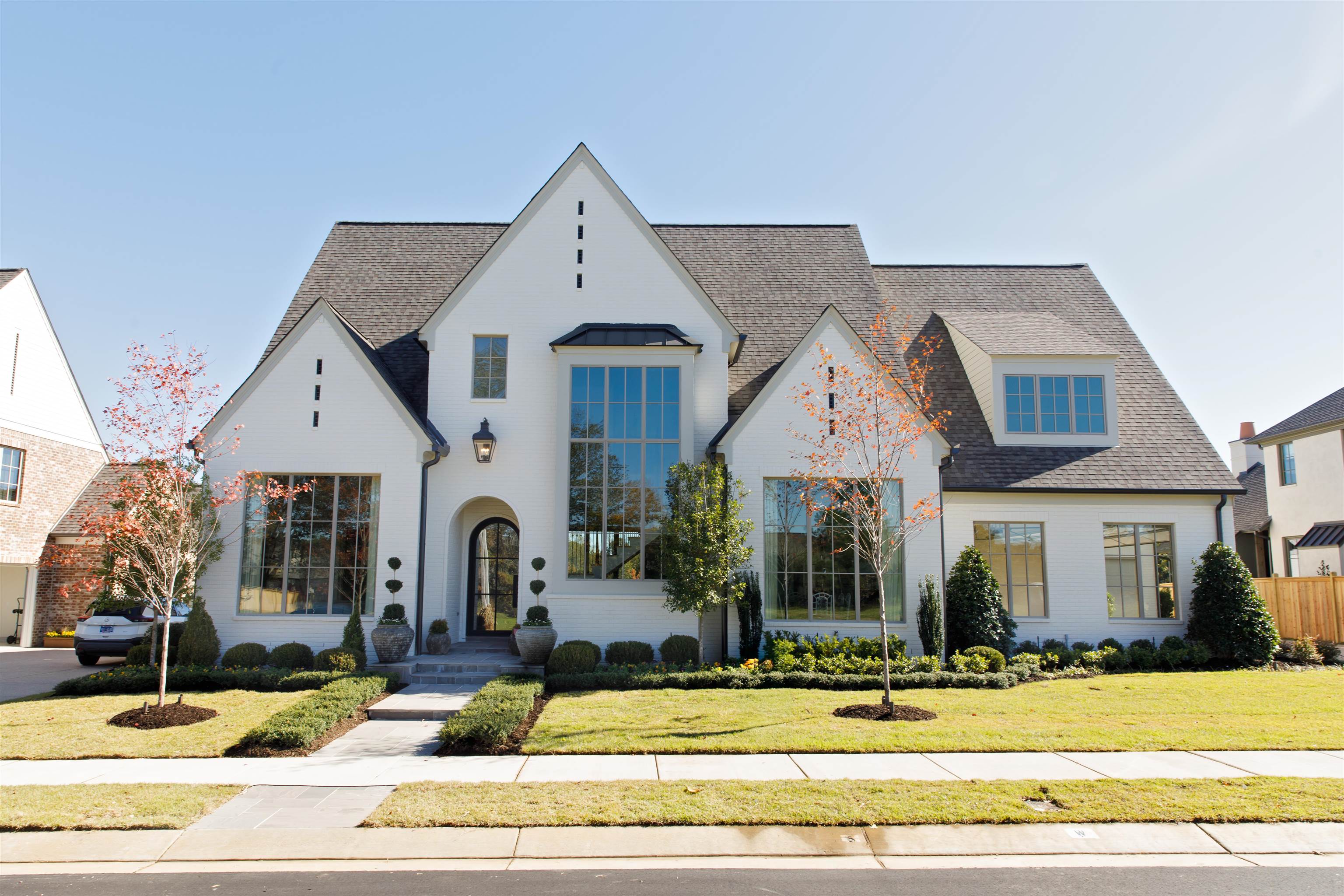a front view of a house with garden