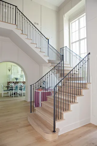 a view of living room with furniture and wooden floor