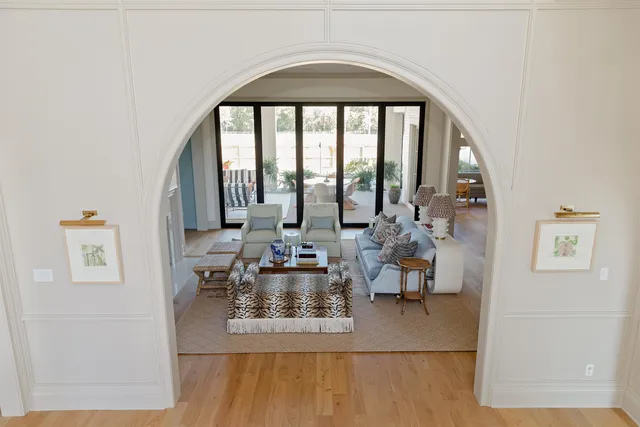 a view of staircase with railing and white walls