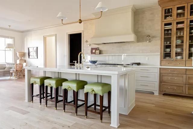 a kitchen with cabinets and wooden floor