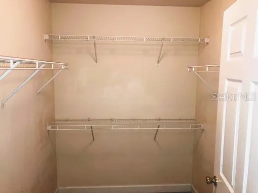 a view of a room with racks on the wall