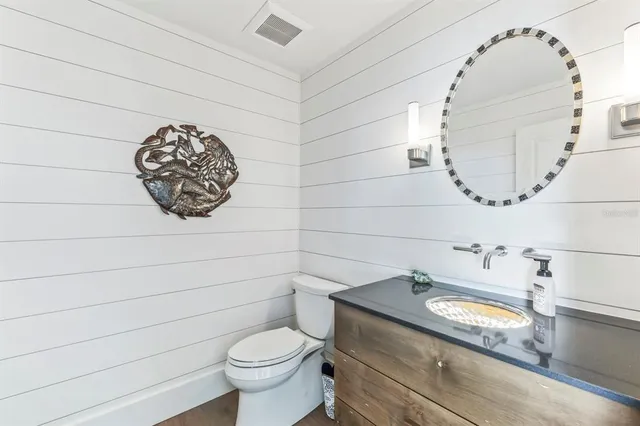 a bathroom with a tub a sink and shower