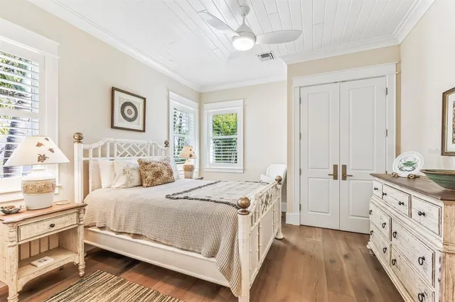 a view of a lake with boats and trees in the background