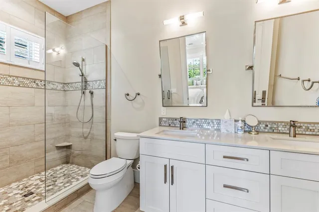 a front view of a house with yard and porch