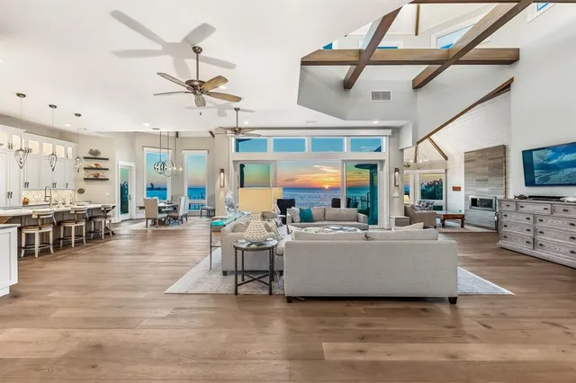 a living room with fireplace furniture and a flat screen tv