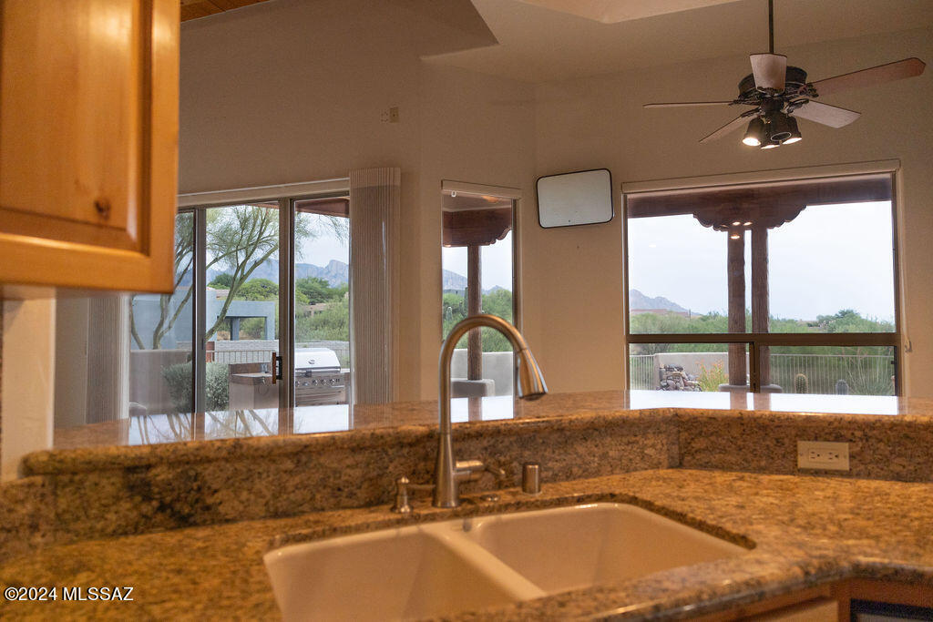771 West Sedona Ridge Place Oro Valley, AZ 85755 - Photo 9 of 22 a bathroom with a granite countertop sink and a large window