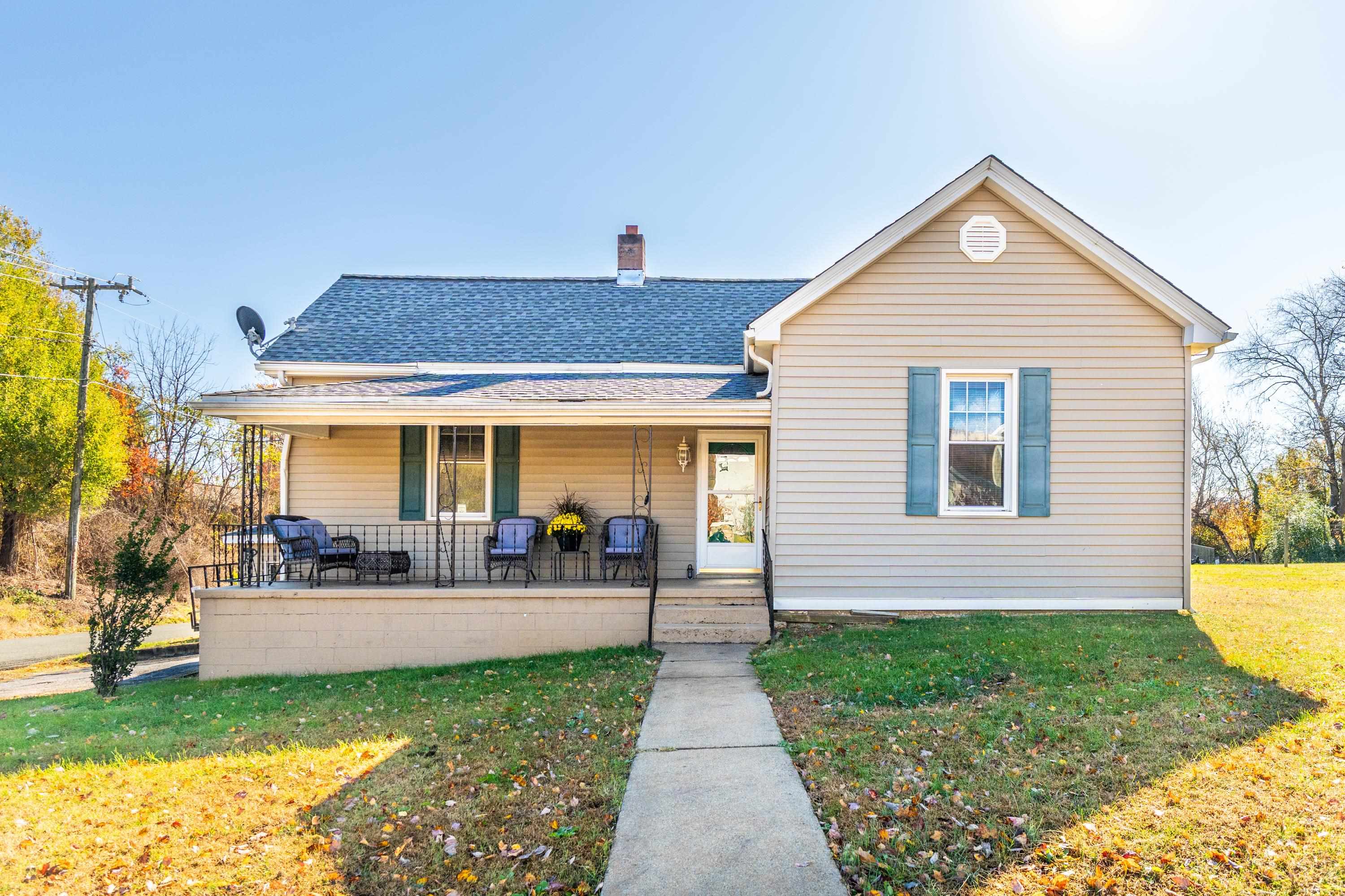 1261 Blue Ridge Avenue Crozet, VA 22932 - Photo 1 of 25 a view of a house with a chairs in patio