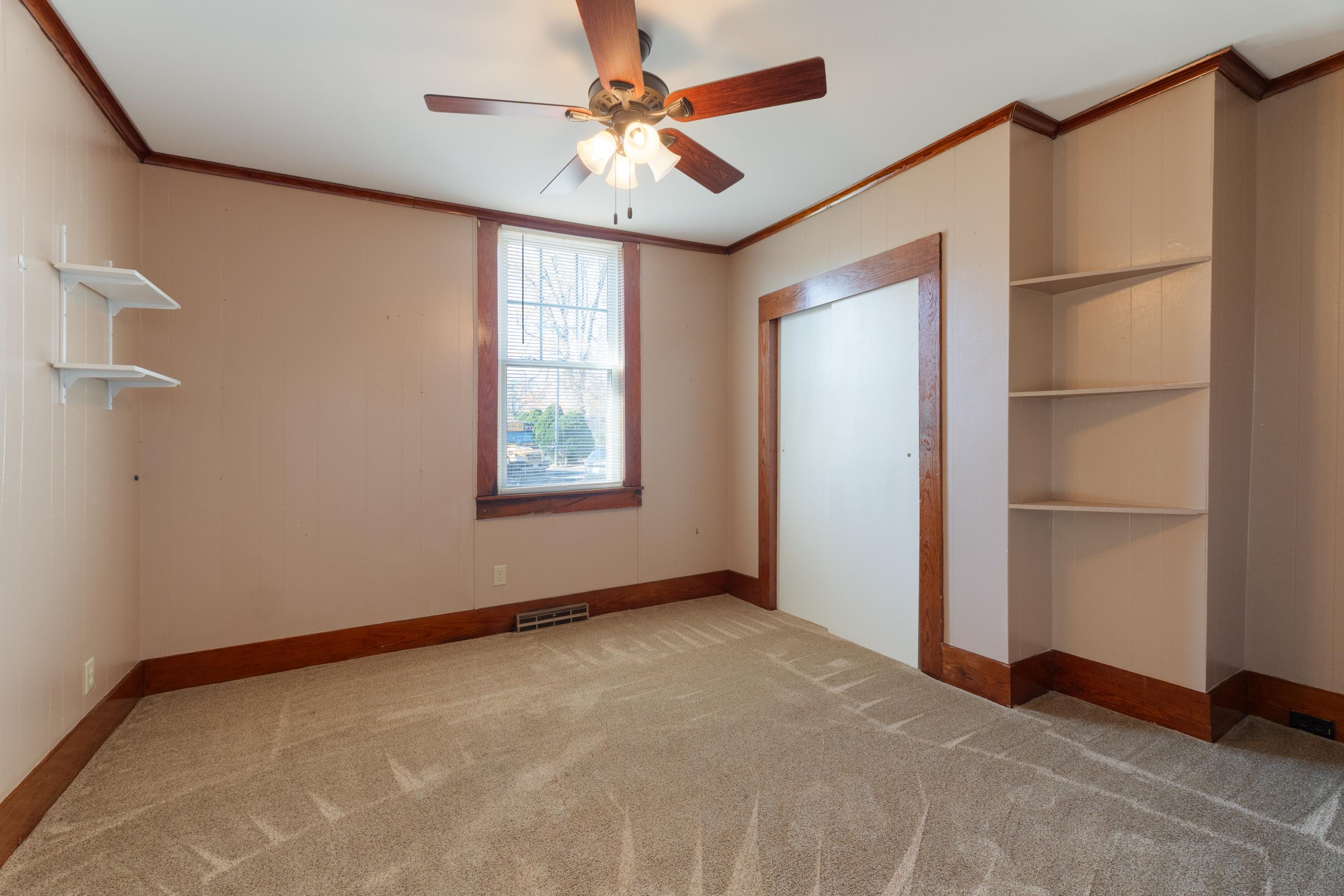 1261 Blue Ridge Avenue Crozet, VA 22932 - Photo 12 of 25 an empty room with windows and fan