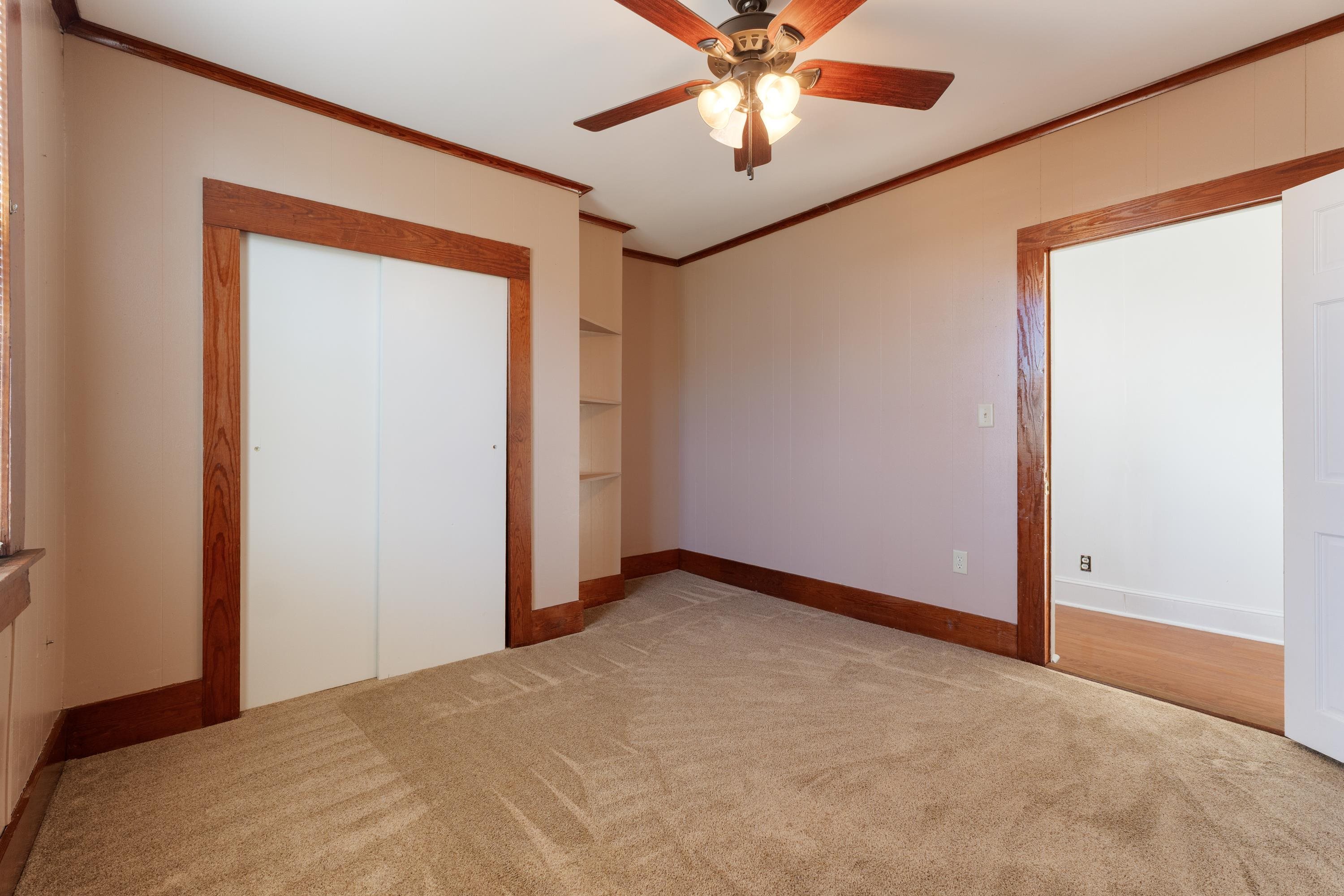 1261 Blue Ridge Avenue Crozet, VA 22932 - Photo 13 of 25 an empty room with a window and a fan