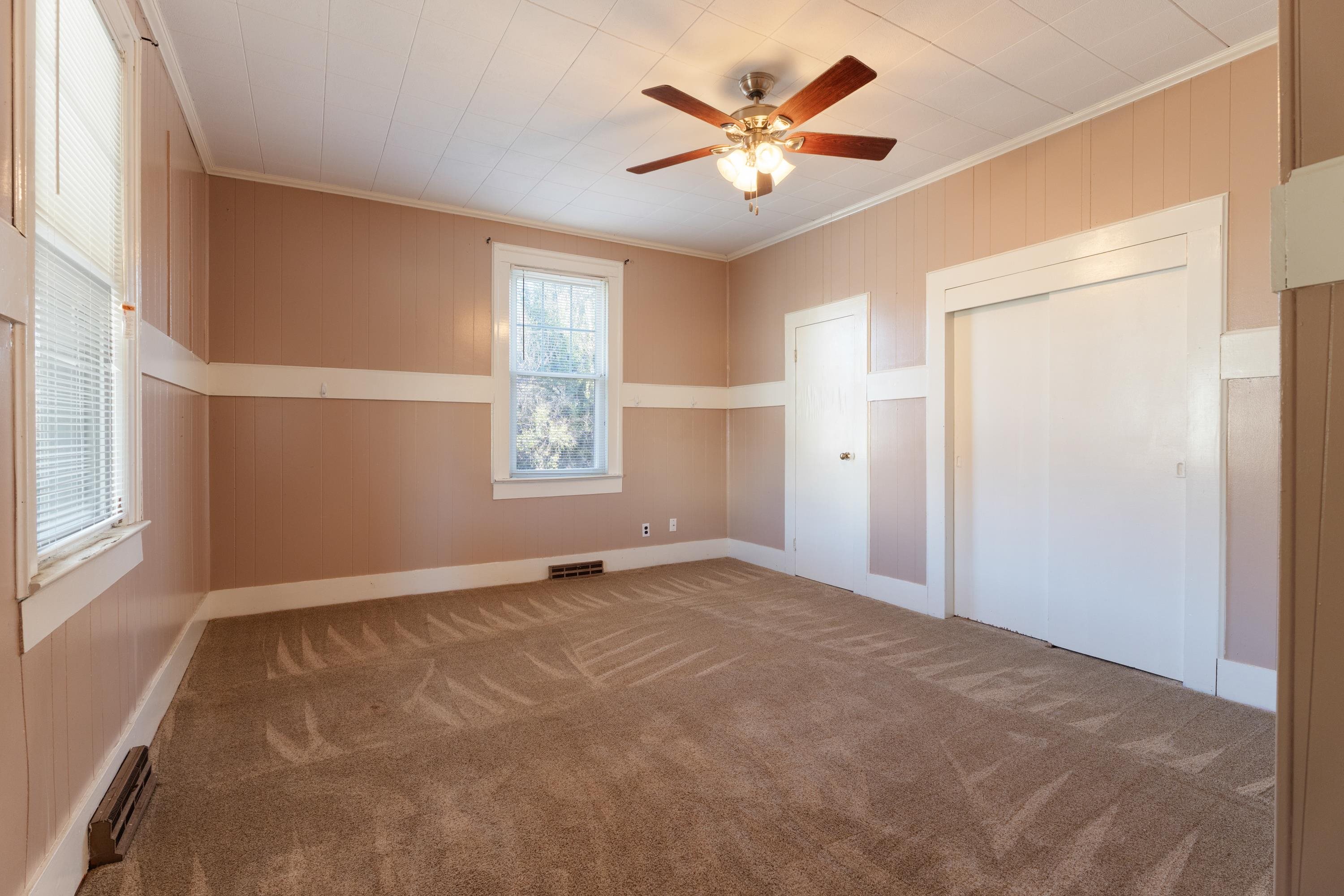 1261 Blue Ridge Avenue Crozet, VA 22932 - Photo 9 of 25 an empty room with windows and fan