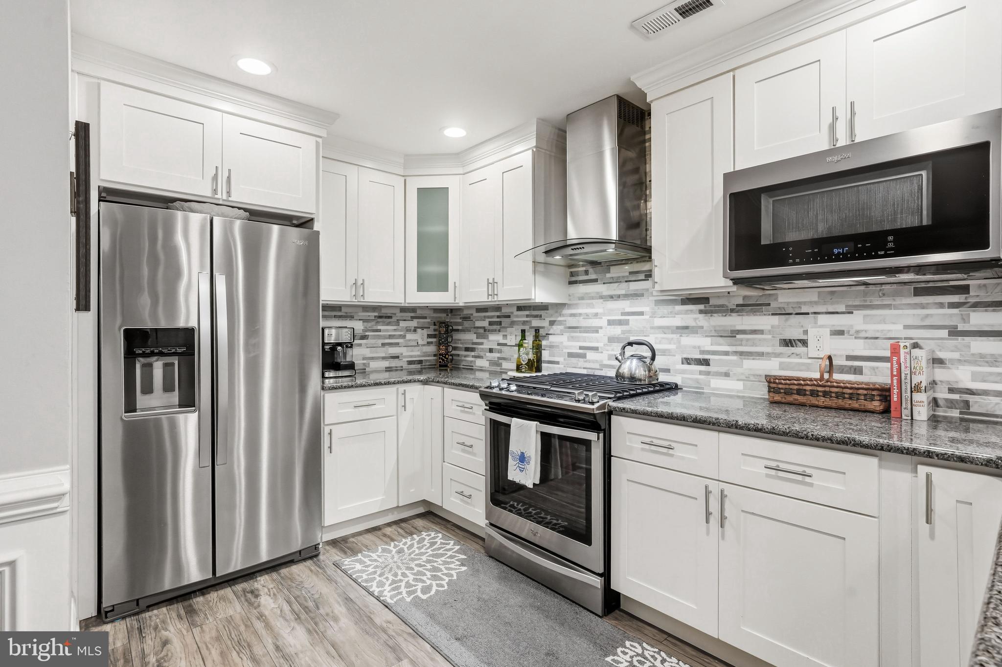 144 Natalie Road Delran, NJ 08075 - Photo 11 of 43 a kitchen with stainless steel appliances granite countertop a refrigerator stove microwave and sink