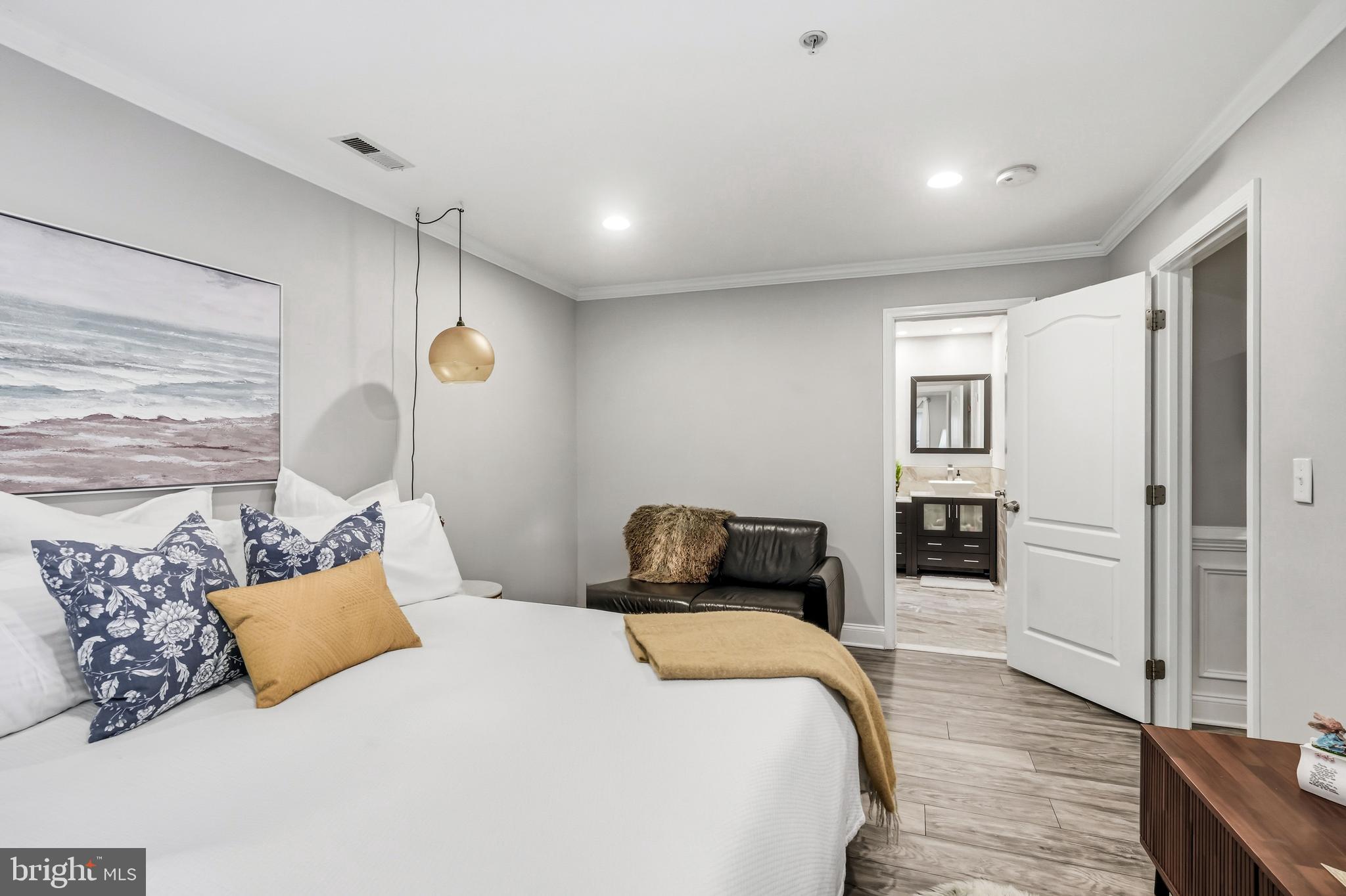 144 Natalie Road Delran, NJ 08075 - Photo 19 of 43 a bedroom with a bed and wooden floor