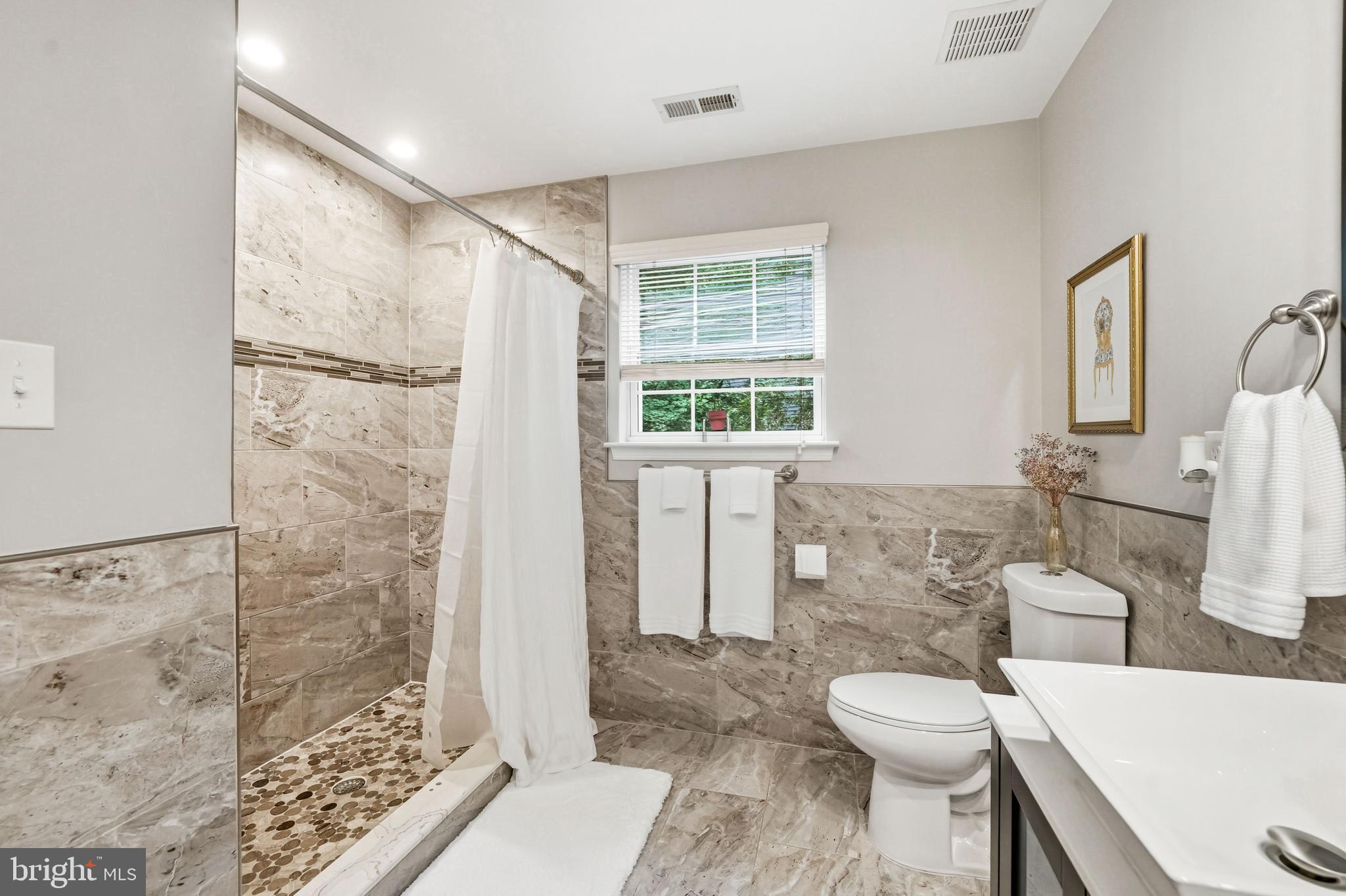 144 Natalie Road Delran, NJ 08075 - Photo 21 of 43 a white toilet sitting next to a bathroom sink